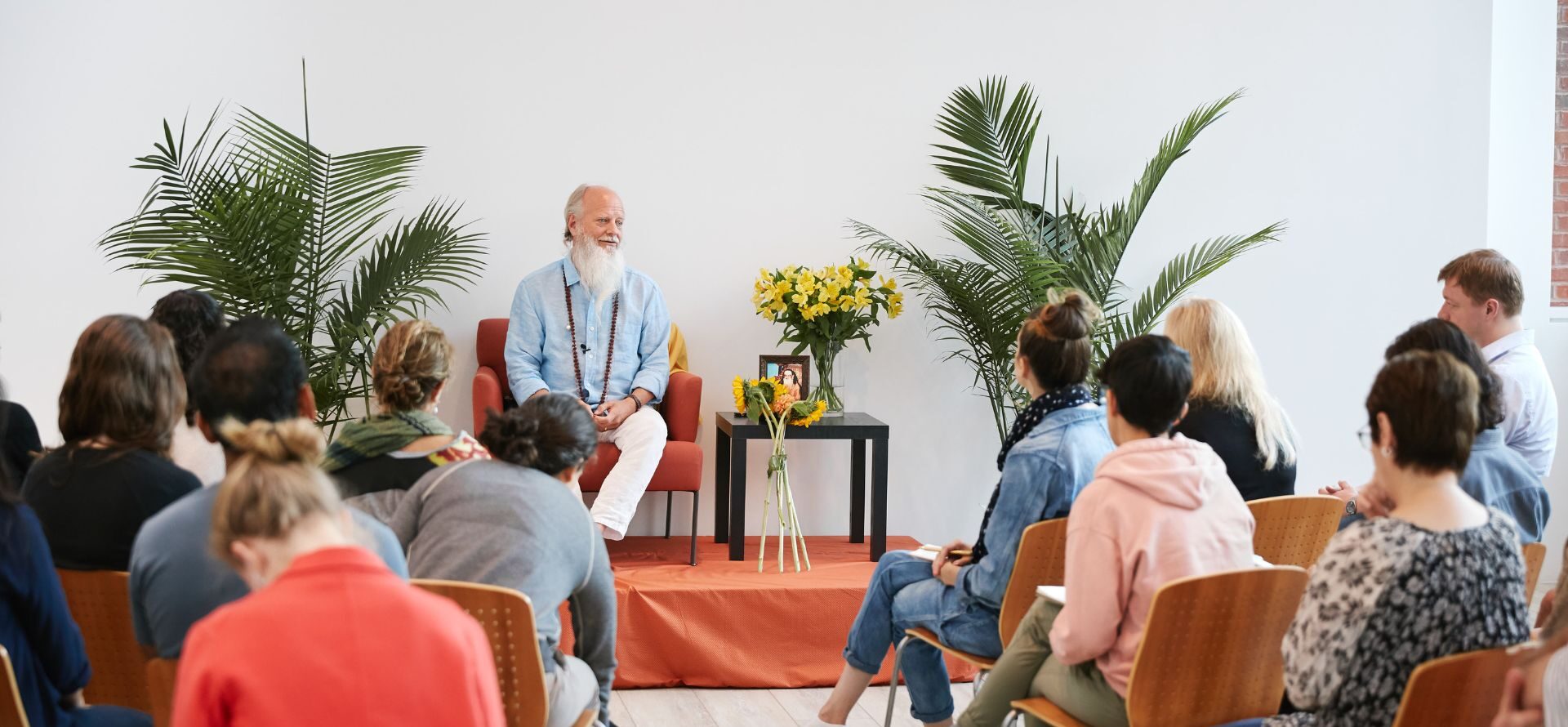 Thom Knoles speaking infront of audience